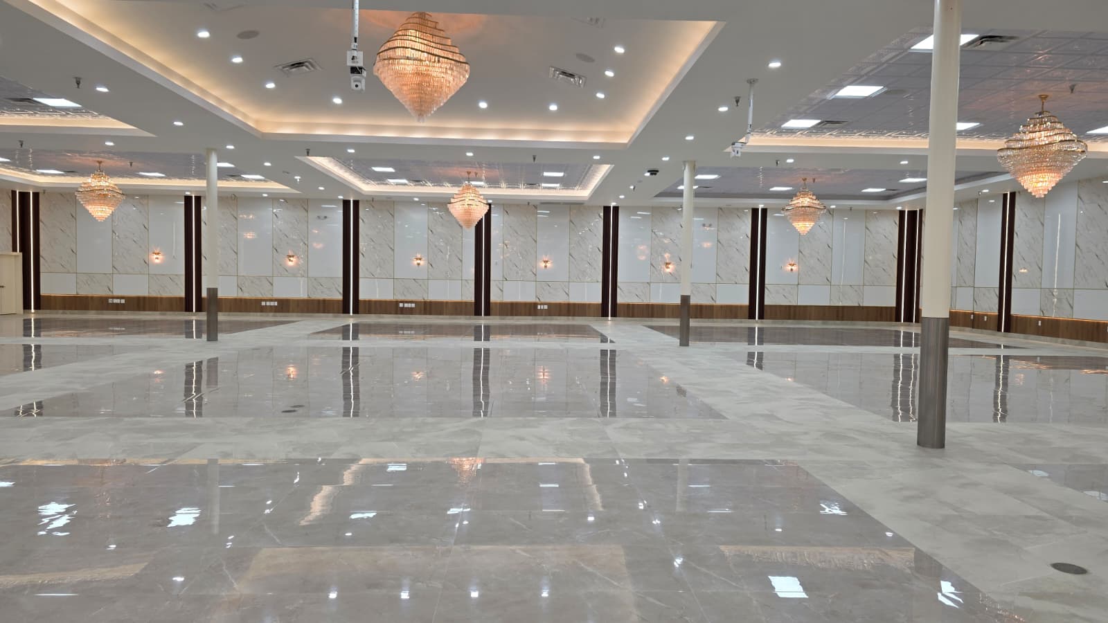 Hall ready for set-up — full marble floor